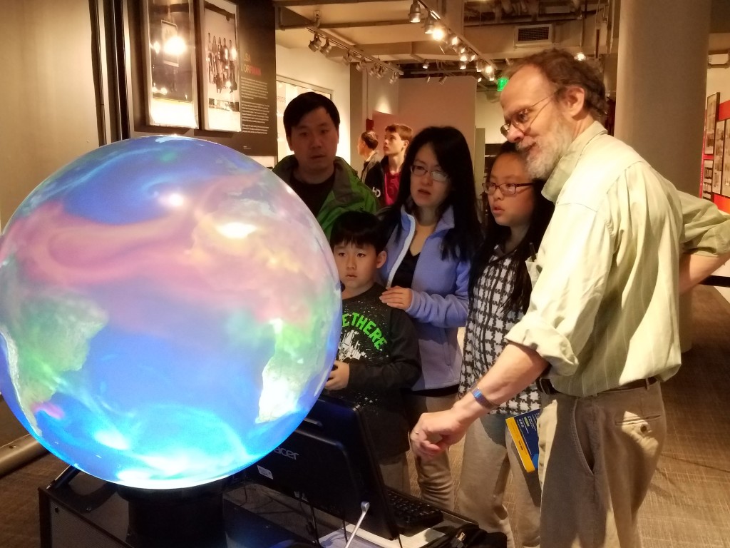 Oceanographer Glenn Flierl explains ocean and atmospheric processes using the iGlobe. (Photo: Lauren Hinkel)